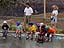Little kids at Big Mine Skate Park sit and watch with amazement at what the big kids can do on a board.