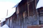Snow covers a historic shed in one of Crested Butte’s back alleys